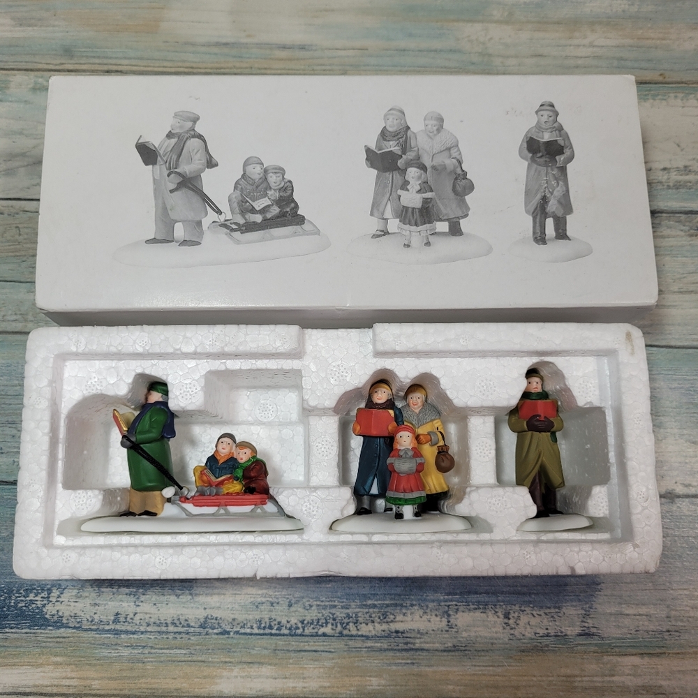 Department 56 Caroling Thru The city. Set of 3.
